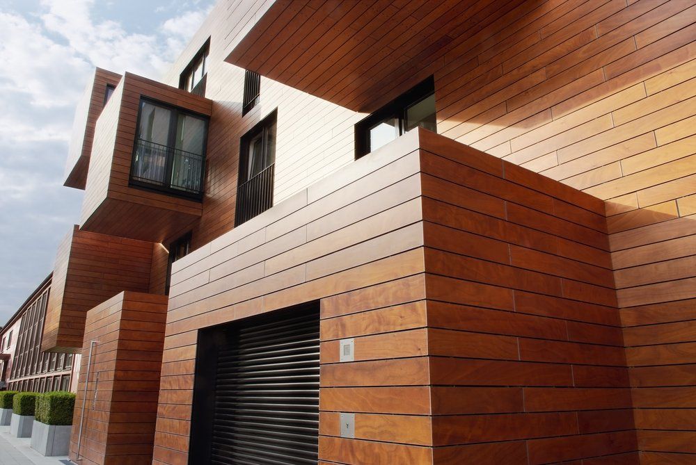 A building with a lot of windows and a wooden facade