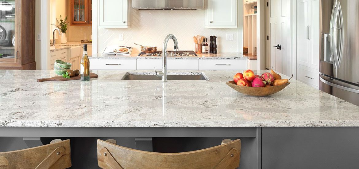 grey kitchen interior with gas stove and plant on the table