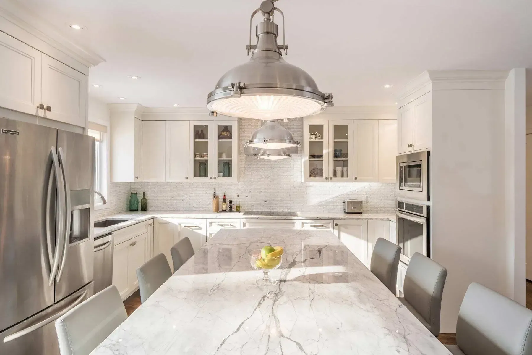 grey kitchen interior with gas stove and plant on the table