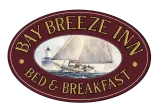 Bay Breeze Inn Bed & Breakfast oval logo with sailboat illustration on maroon background