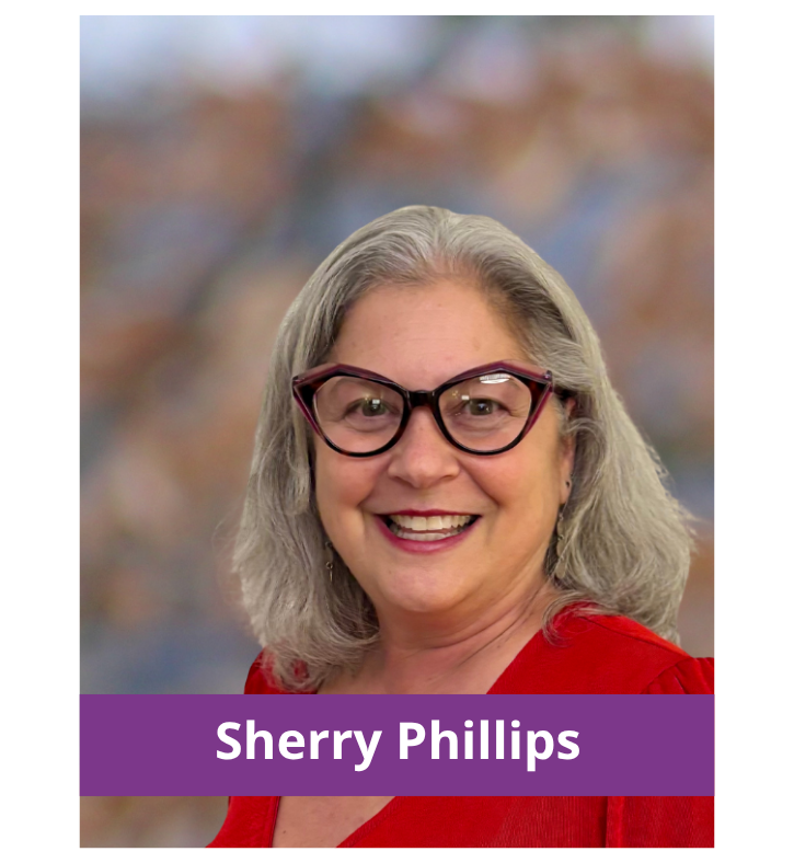 Sherry Phillips wearing a red shirt and glasses