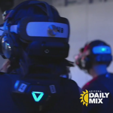 People wearing VR headsets in a blue-lit indoor setting, with an Arizona Daily Mix logo in the corner