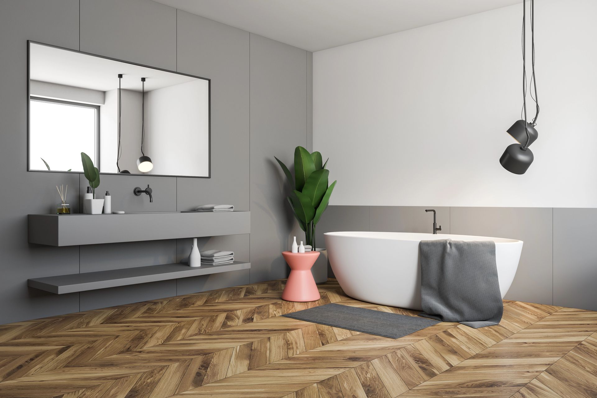 Modern bathroom with freestanding tub, wall vanity, potted plants, and herringbone wood floor