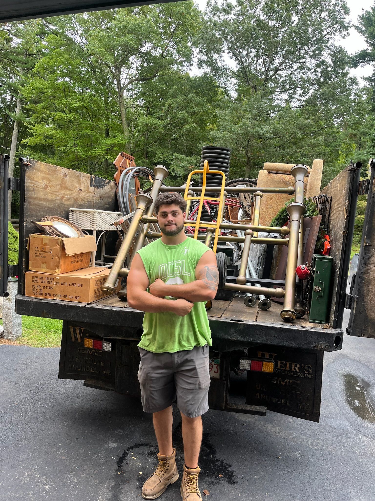 Estate cleanout crew clearing furniture from a large home