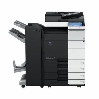 A black and white printer is sitting on a white surface.