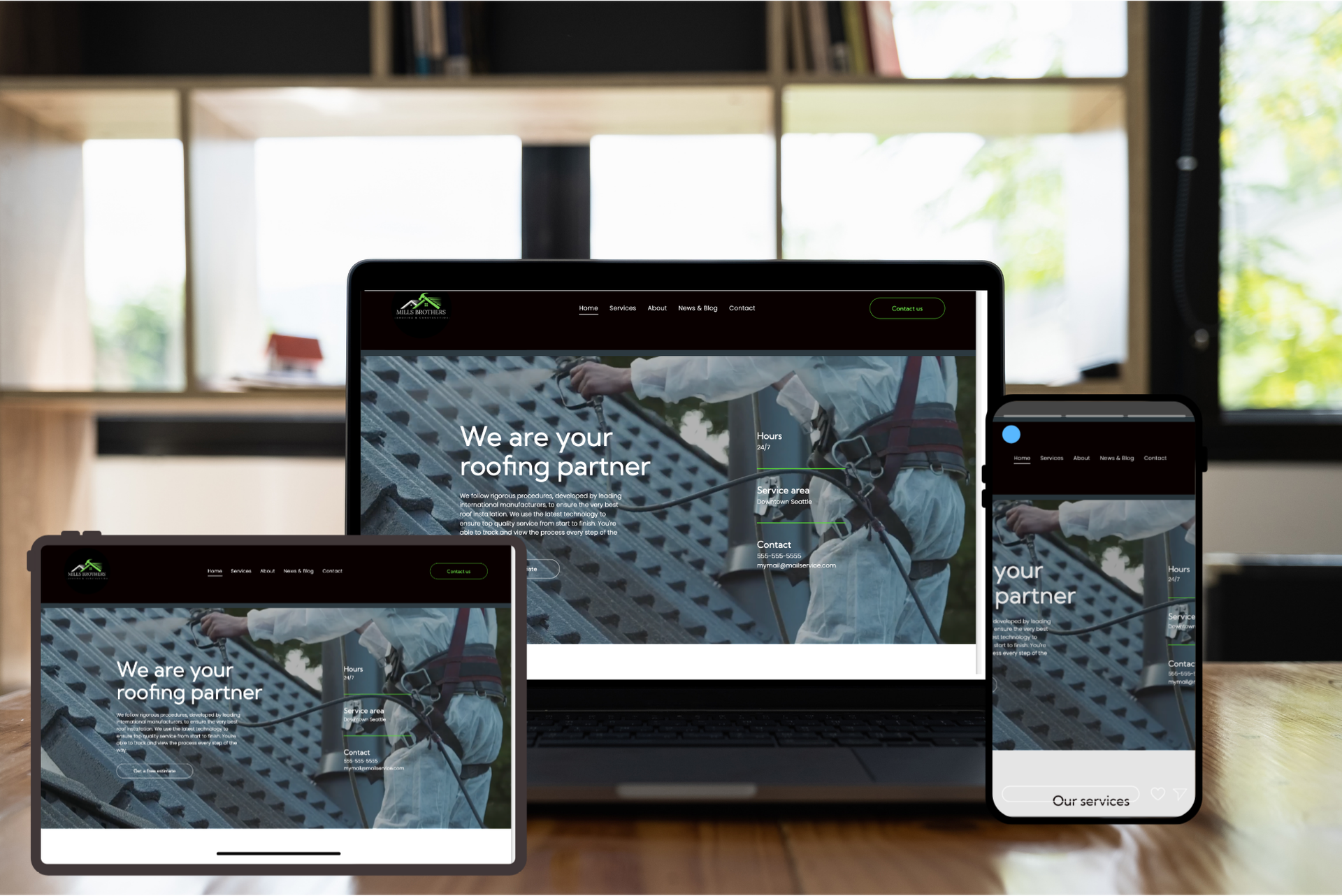 Responsive website displayed on laptop, tablet, and phone in a bright room