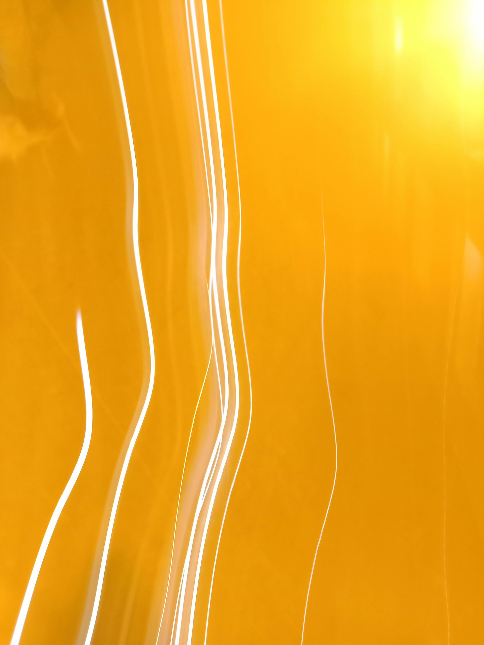 A yellow background with reflective light strings.