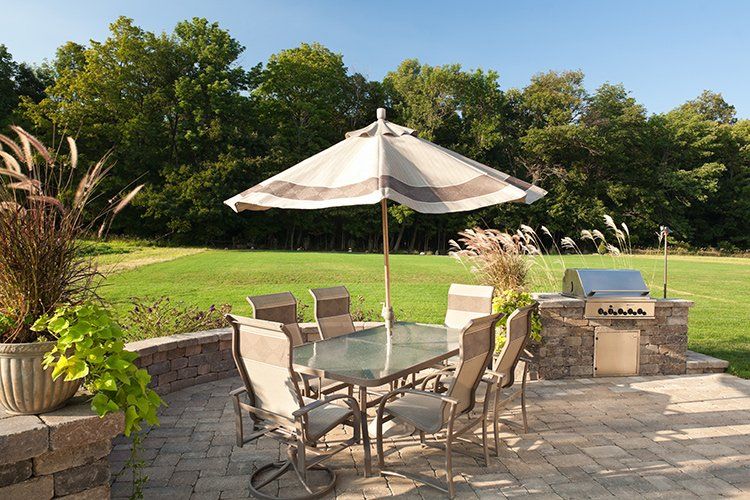 Patio with Outdoor Kitchen — Waukegan, IL — Manuel Brick Paving & Landscaping Patio with Outdoor Kitchen — Waukegan, IL — Manuel Brick Paving & Landscaping