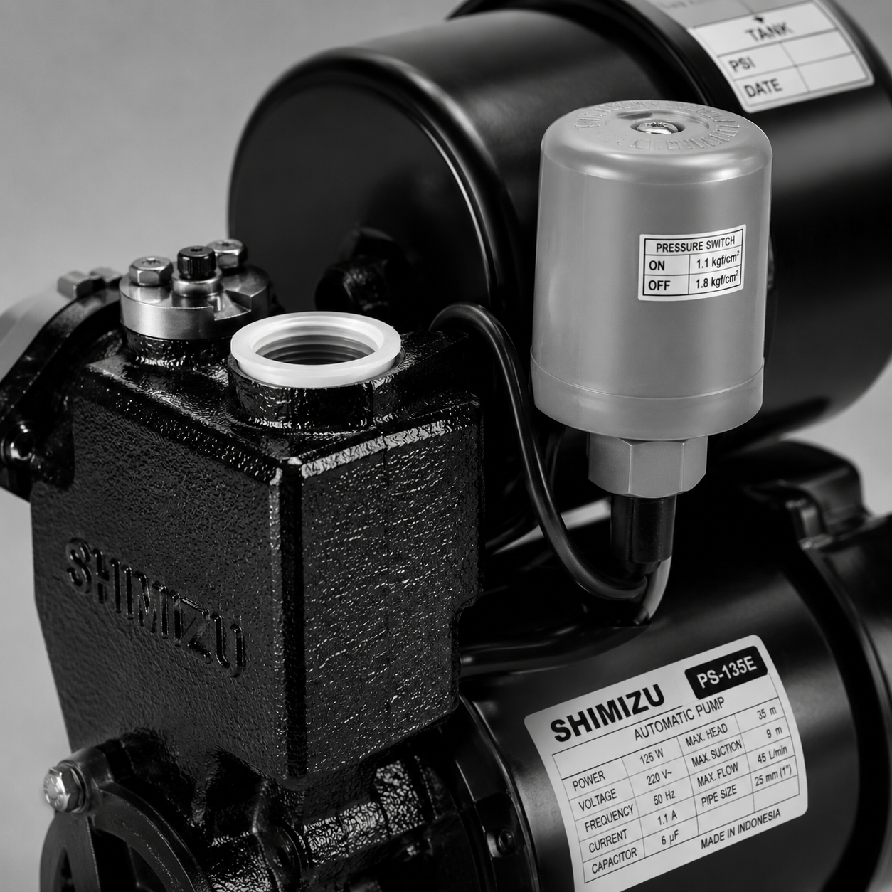 Close-up of a black and silver Shimizu electric water pump with attached motor and control box