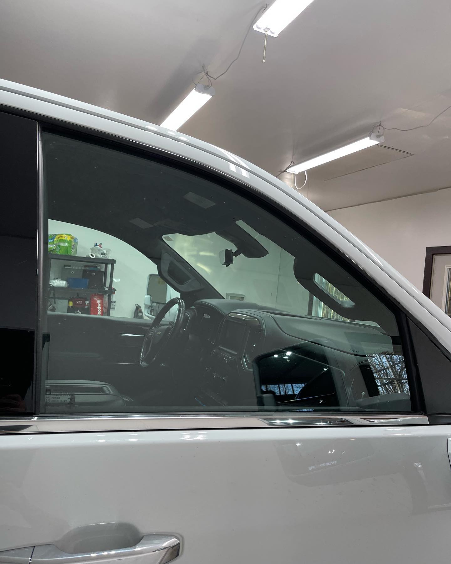 White truck side window with tinted glass. Interior visible.