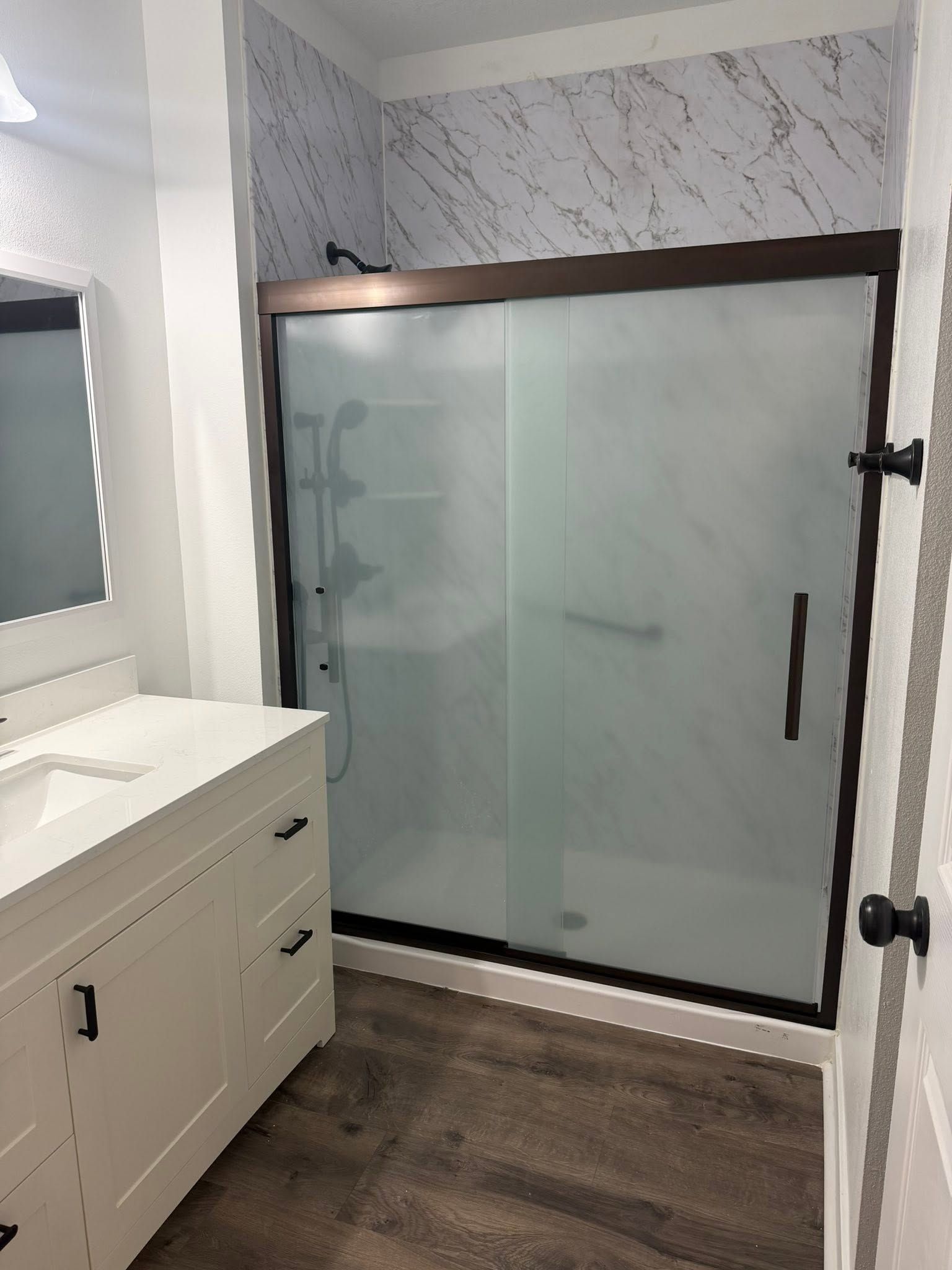Contractor reviewing remodeling project plan at kitchen countertop