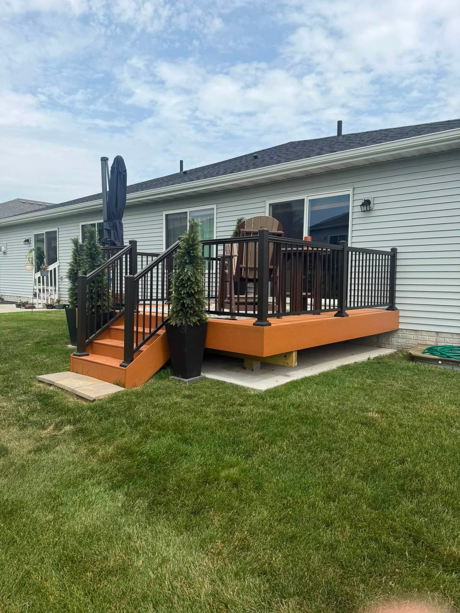 Anything Roofing and Construction framing a residential deck with pressure-treated lumber in Granger Iowa