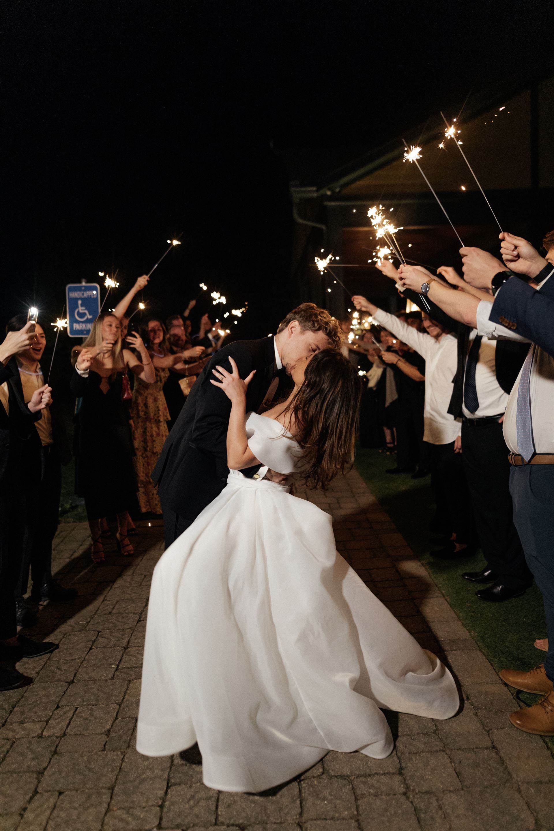 Newlyweds kiss during a sparkler send-off; a group of people hold sparklers at night.