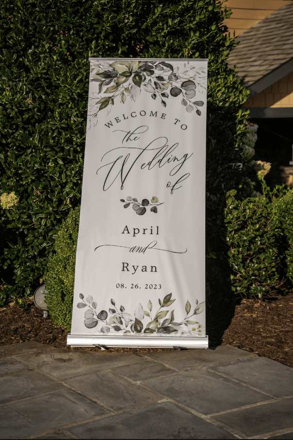 Wedding welcome sign with floral design. Reads 