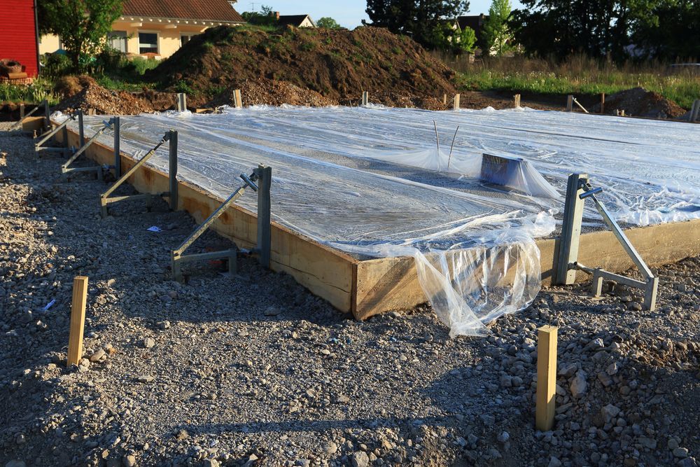 Foundation Site With Wooden Formwork, Covered in Plastic — DPC Decorative Patterned Concrete in Nambour, QLD