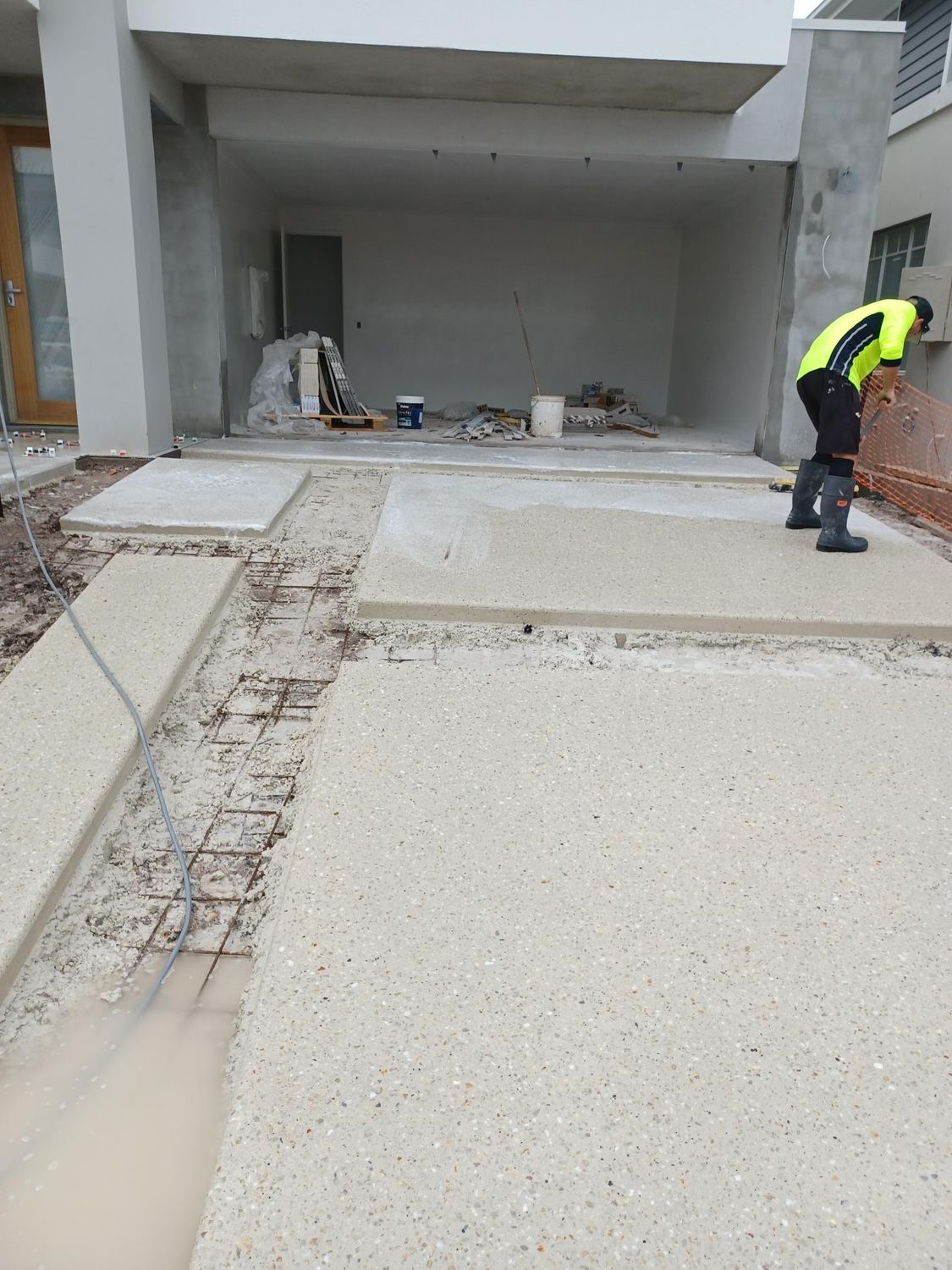 Construction Worker Finishing Concrete Patio — DPC Decorative Patterned Concrete in Sunrise Beach, QLD
