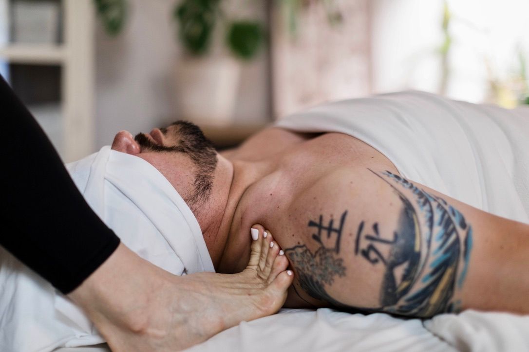 A variation of deep tissue massage by a massage therapist practitioner.