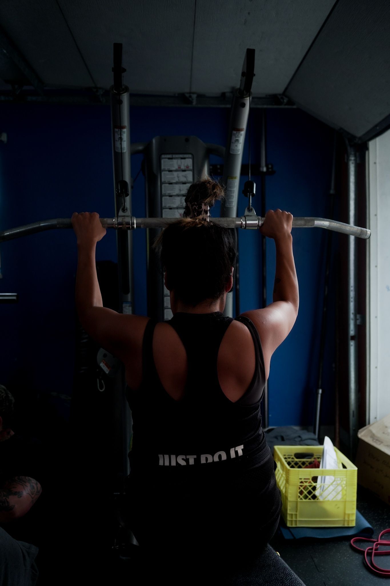 woman lifting weights in a gym setting