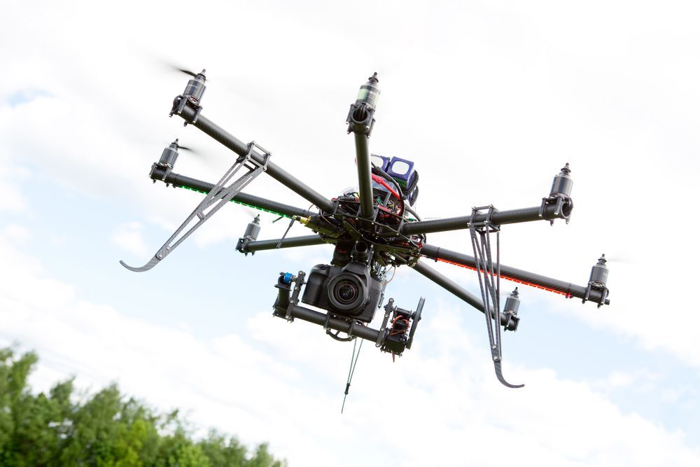 A Multi-rotor Drone With a Professional Camera Attached — Environment Restoration Solutions in Waterview Heights, NSW