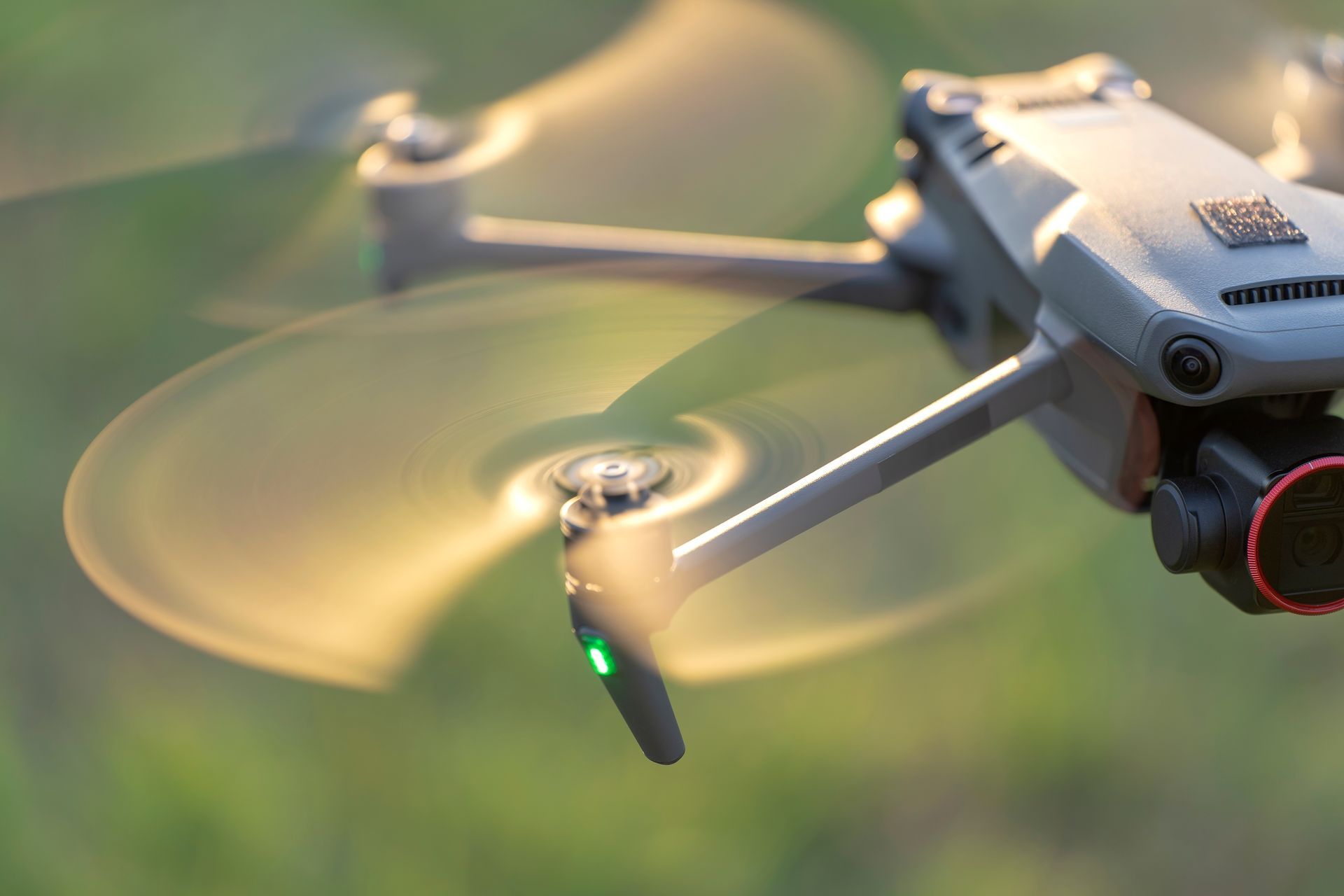 A Gray Drone in Flight With Spinning Propellers — Environment Restoration Solutions in Port Macquarie, NSW