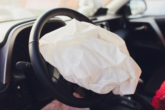 A Car with An Air Bag on The Steering Wheel — Belmont Auto Electrics and Air Conditioning in Belmont, NSW