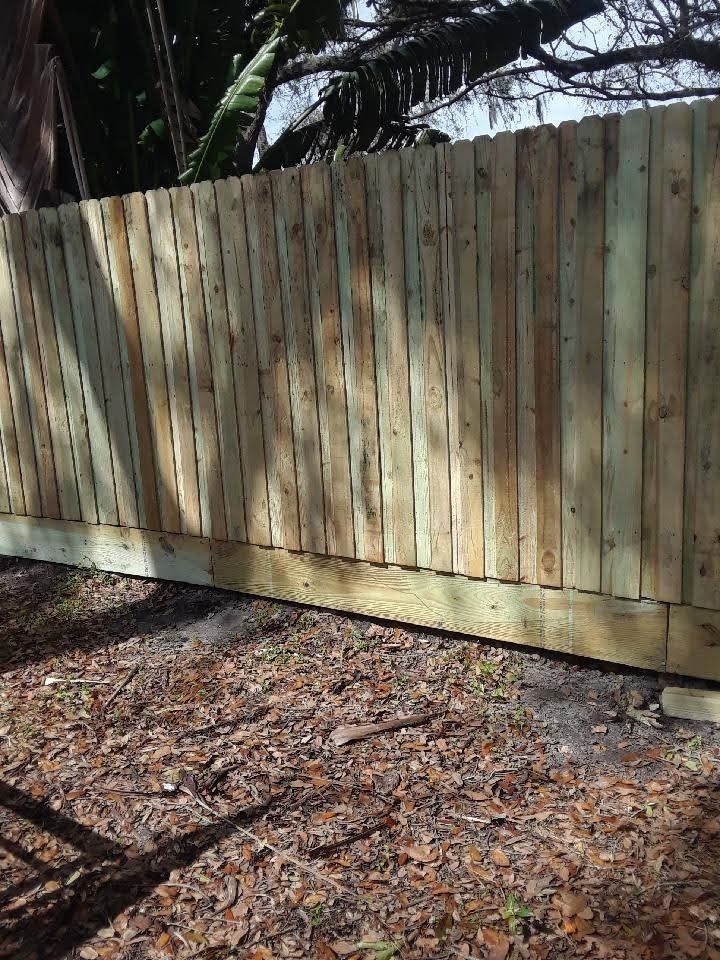 Wood privacy fence with pet board