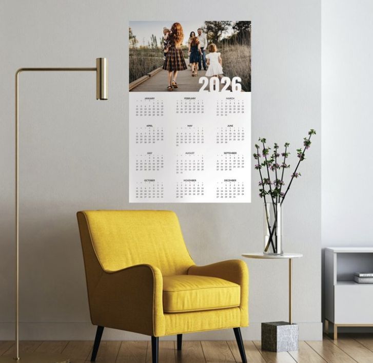 A photo calendar hanging on a wall