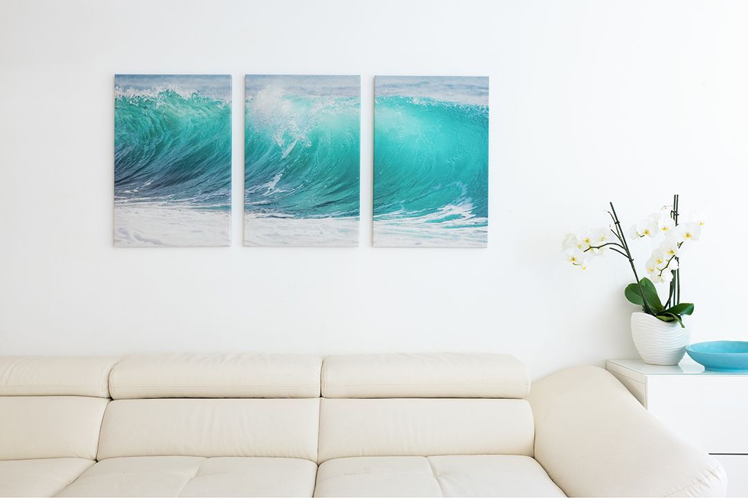 Three canvas photo prints hanging on a wall