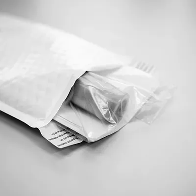 Roll of film being packaged in padded envelope