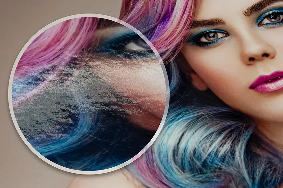film developing Close-up of a woman's face with vibrant, colorful hair printed on Fujicolor Pearl paper. A magnified section highlights the papers texture.