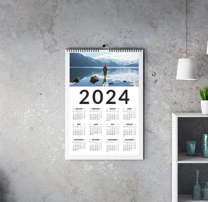 A photo calendar hanging on a wall
