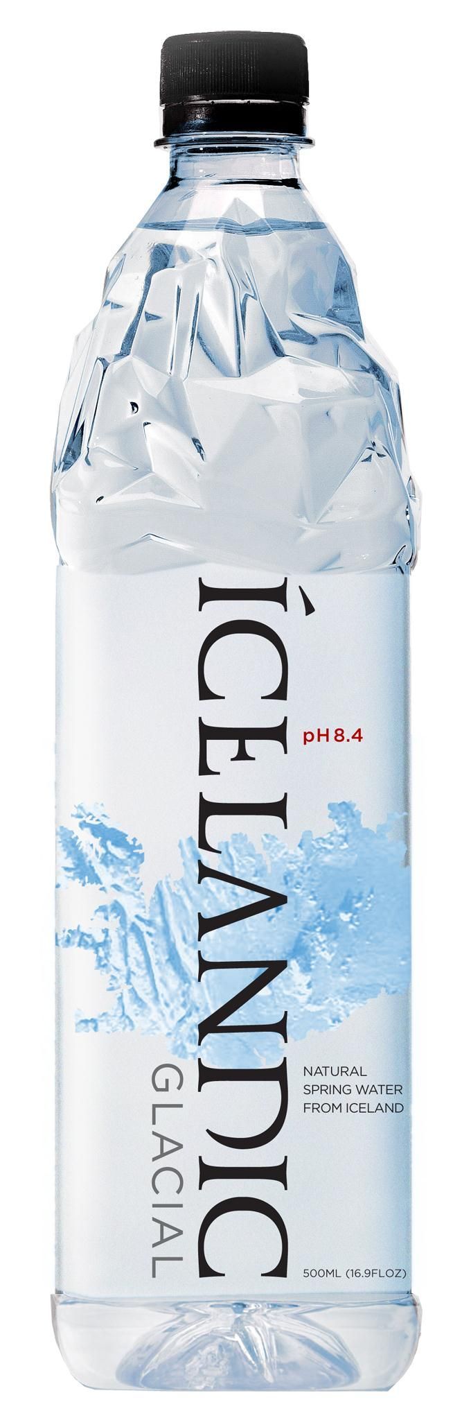 A bottle of icelandic water with a black cap on a white background.