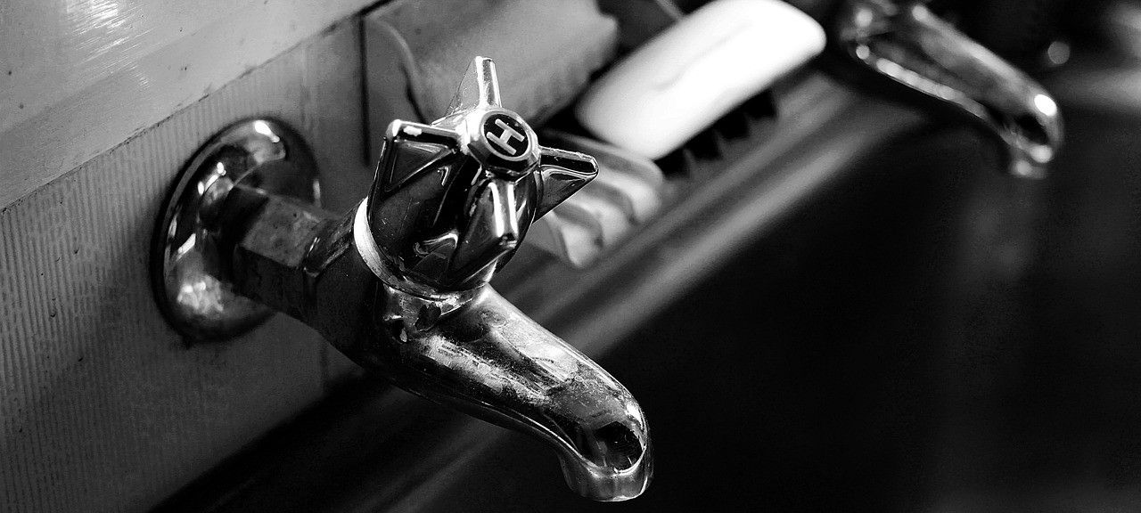 photo of a tap in black and white