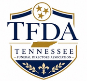 TFDA Tennessee Funeral Directors Association blue-and-gold shield logo with stars and laurel wreath