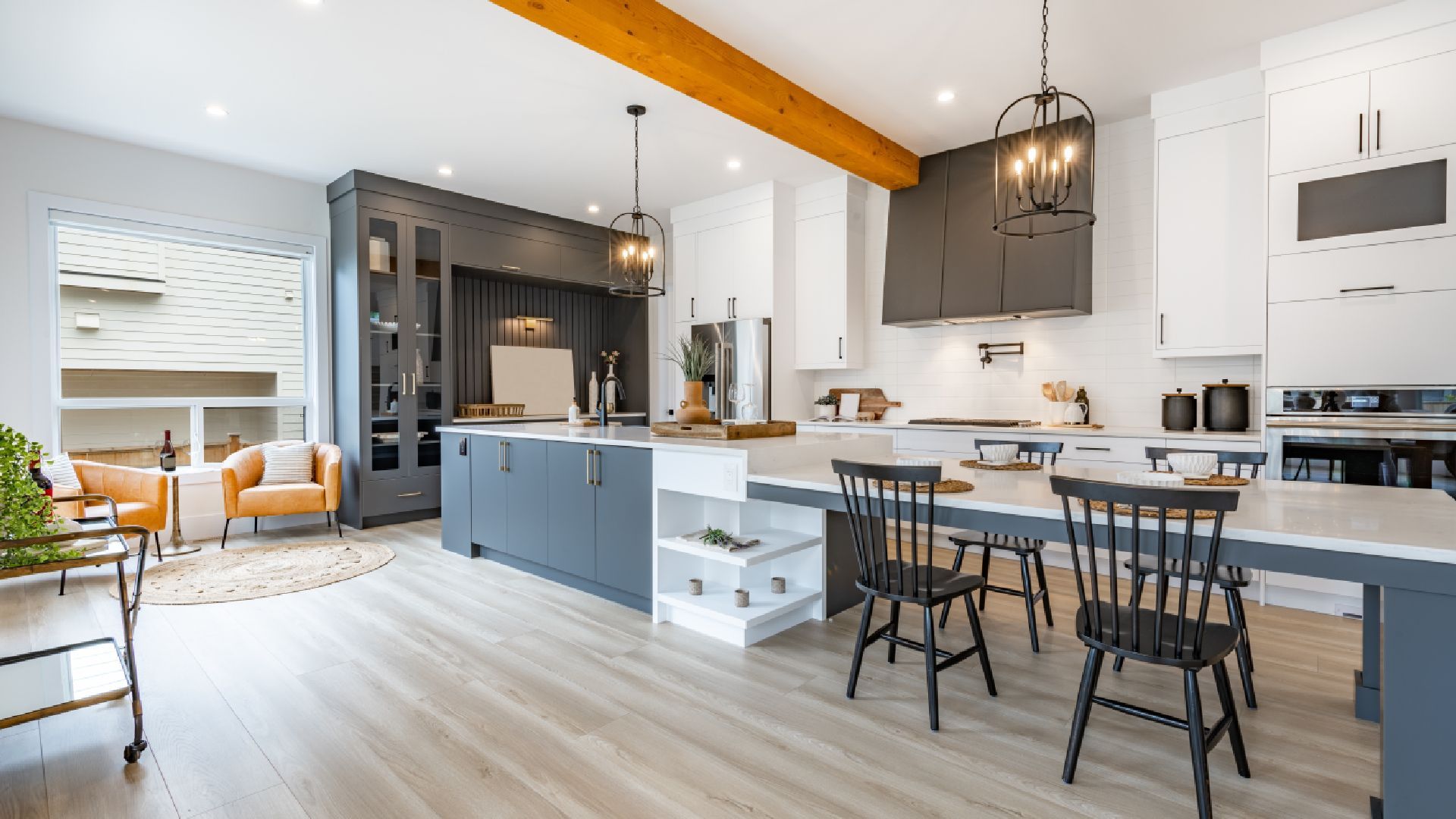 A kitchen with a table and chairs in it.