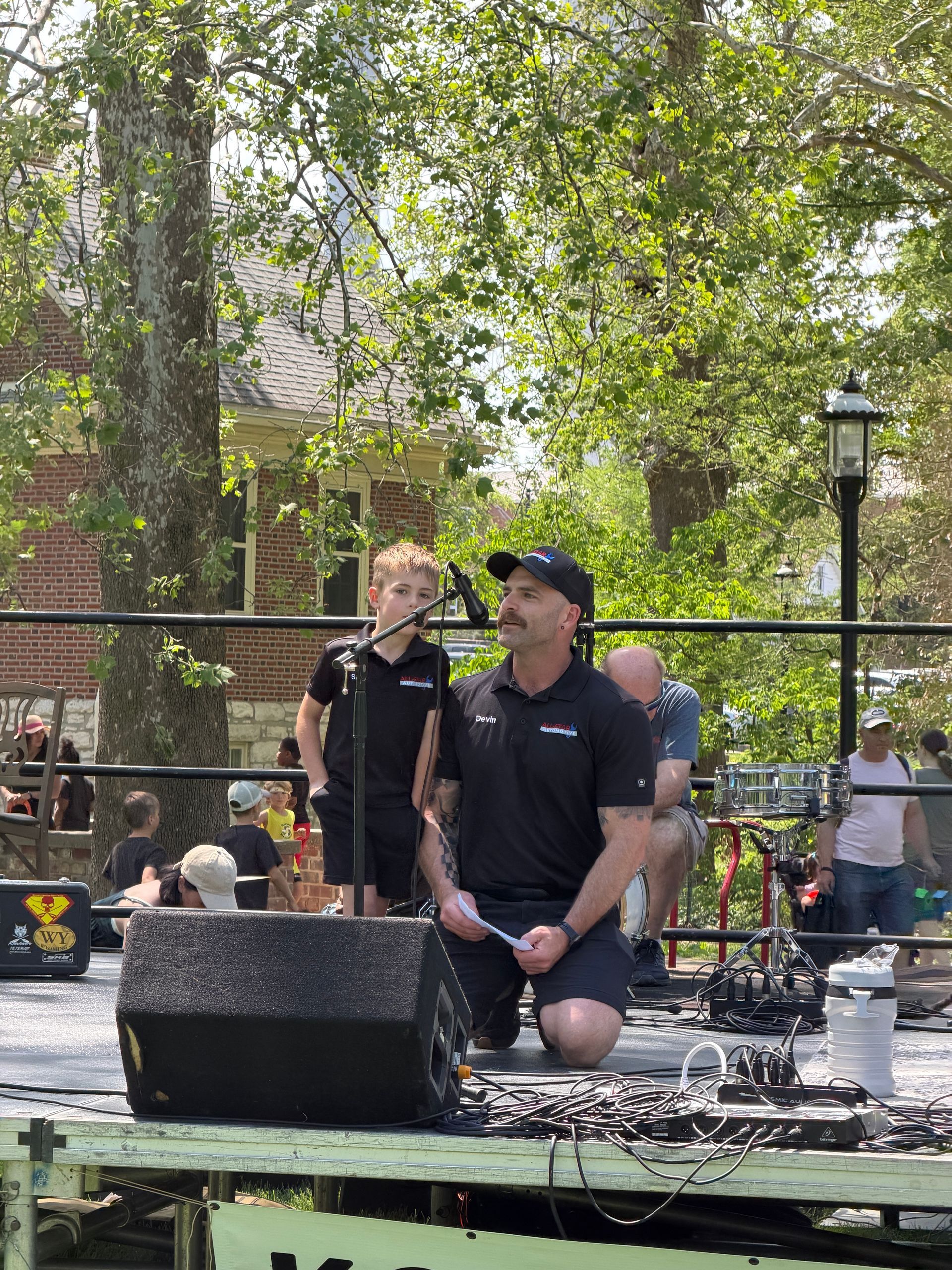 Devin and Silas speaking and representing All-Star Automotive at the Columbia Earth Day Festival stage. 