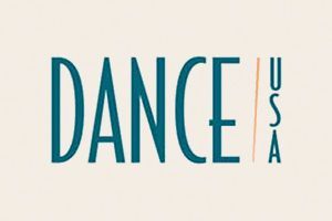 Teal “DANCE” text with small vertical “USA” on a light background