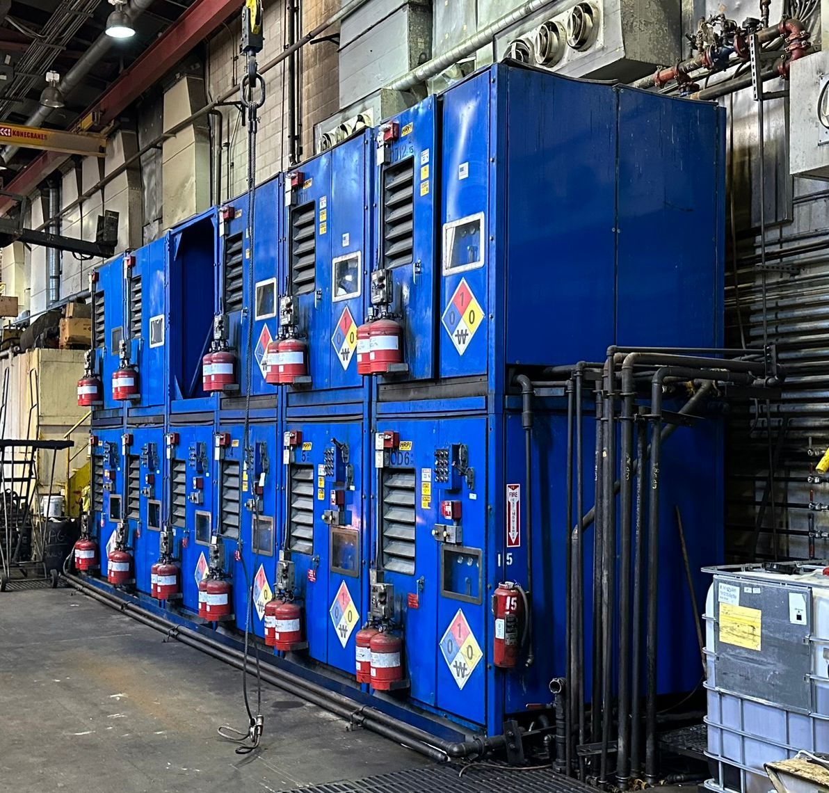 Stacking + enclosed + water-cooled hydraulic power units inside a building in downtown Los Angeles, California, circa ~2005