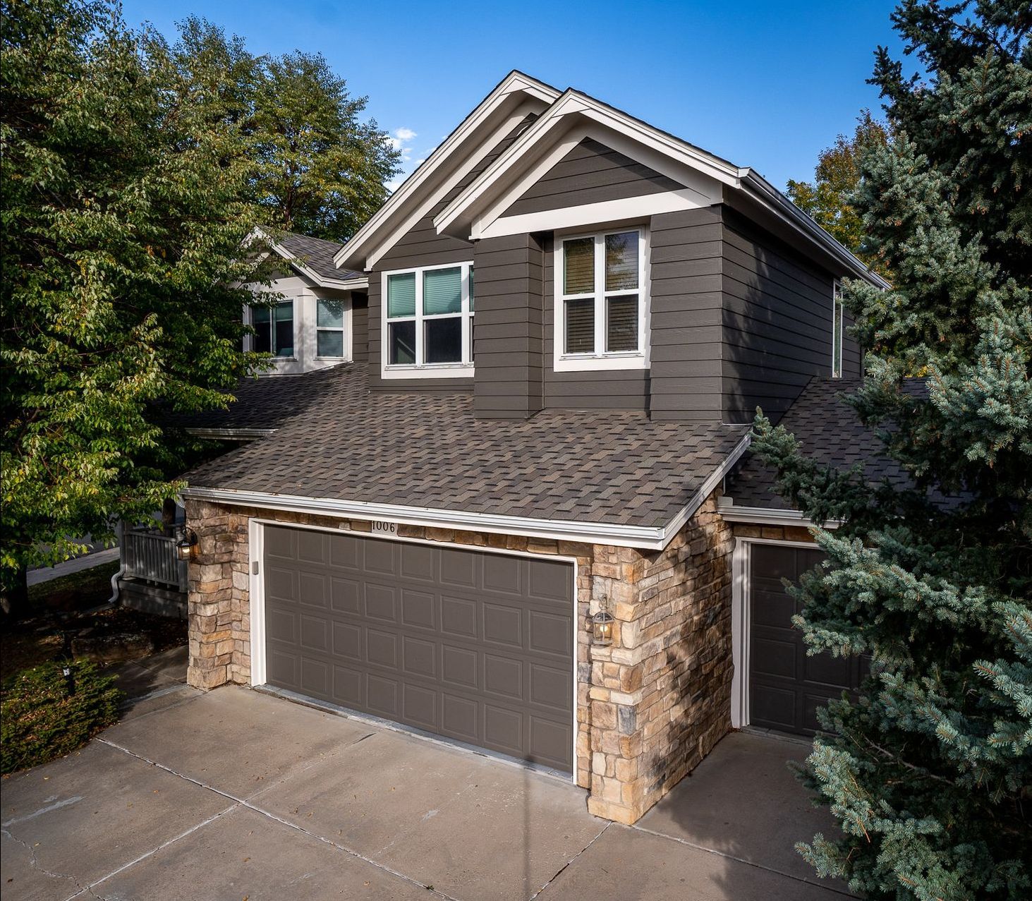 An aerial view of a house with two garage doors | Roofing Contractors Denver CO