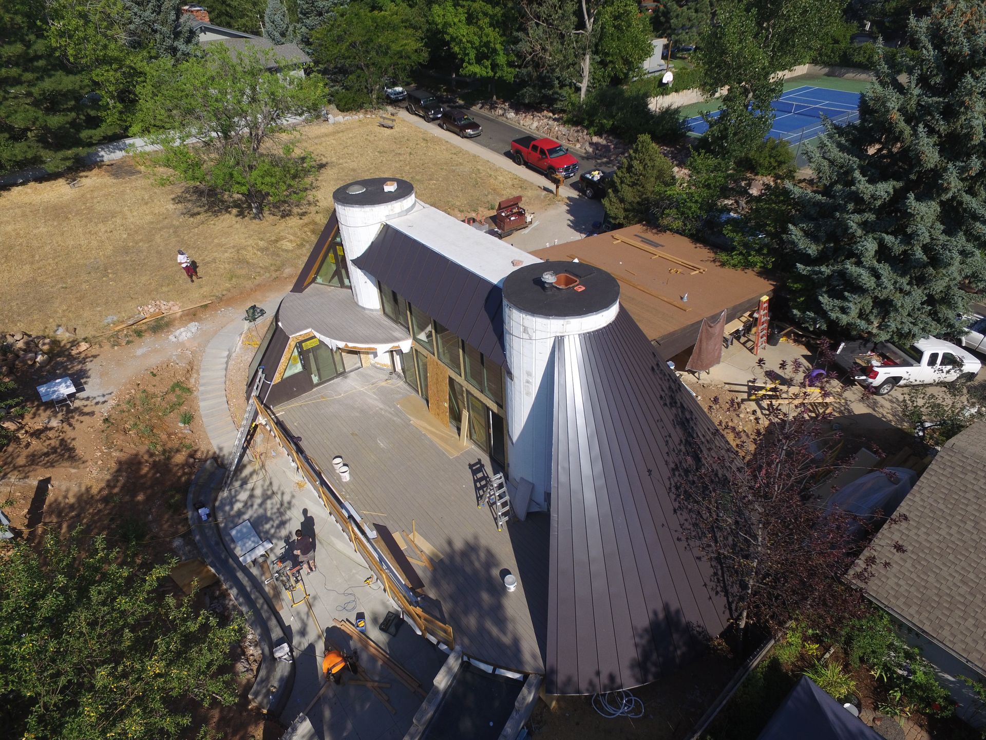An aerial view of a house with two chimneys on the roof