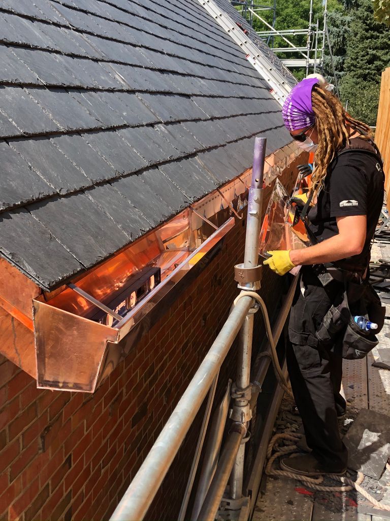 Roofing contractor working on roof remodeling Roofing contractor working on roof remodeling