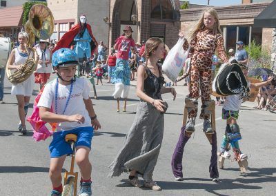 Community and Parade Band at Cherry Days with stilt walkers image