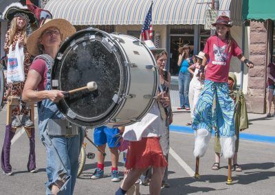 Community and Parade Band at Cherry Days stilt walker picture