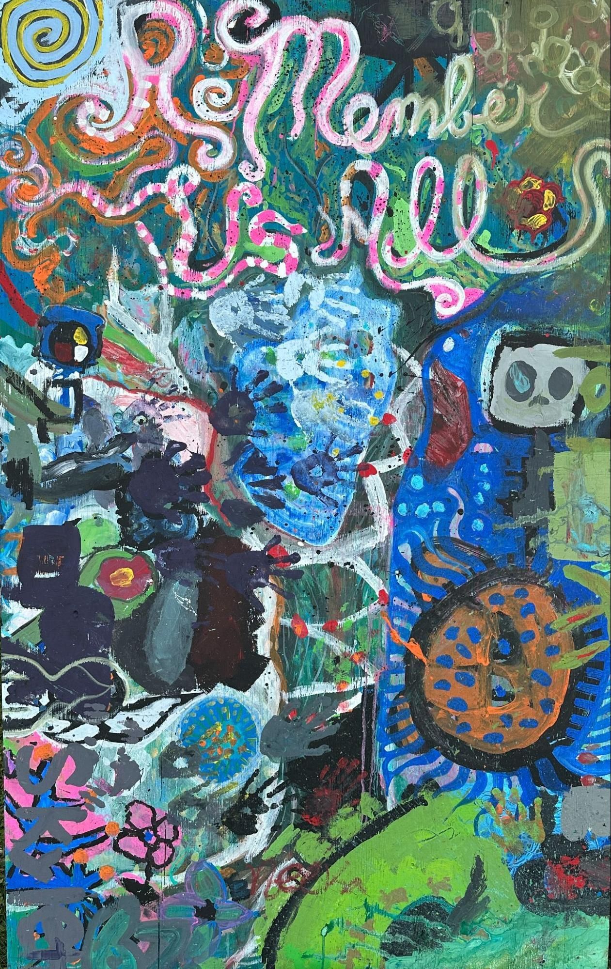 Colorful graffiti mural with a blue face, whimsical figures, and pink cursive lettering over a dark background