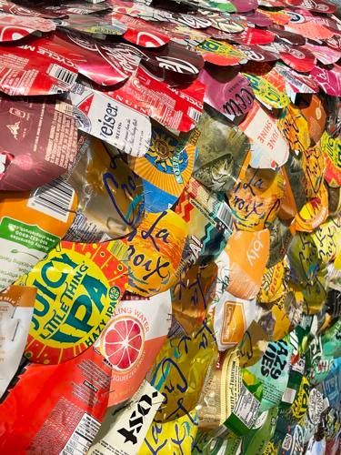 Colorful pile of assorted candy wrappers in a close-up view