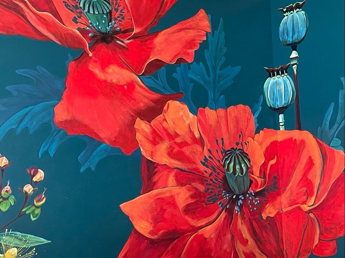 Red poppies and blue seed pods against a teal background in a floral painting