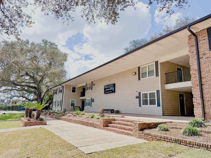 Pensacola apartment building with front landscaping and large windows