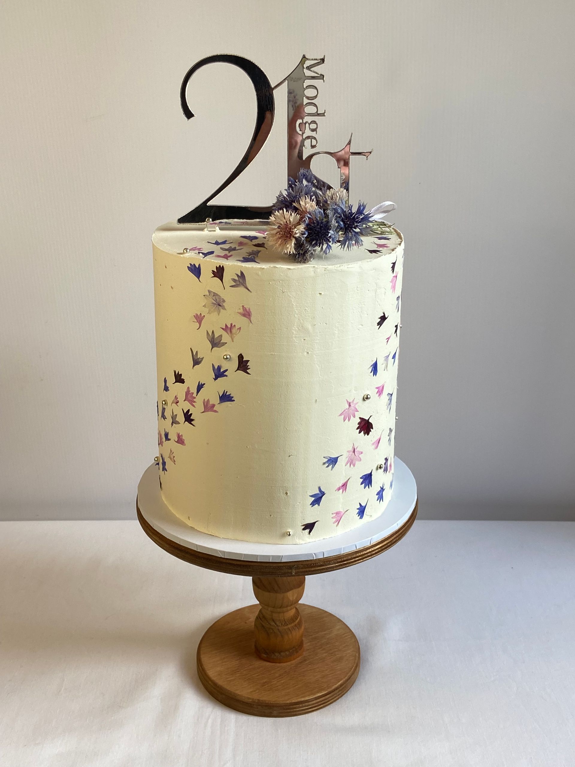 A cake with the number 21 on top of it