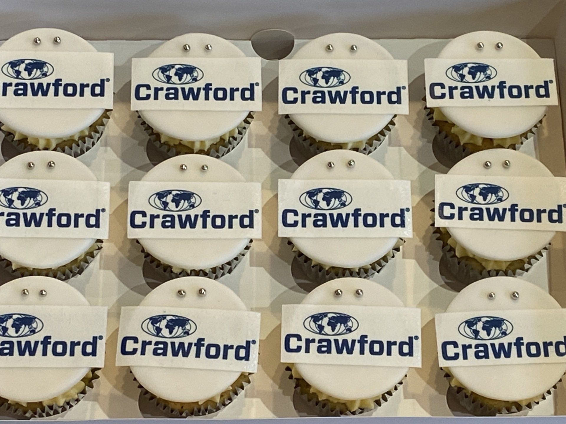 A box of cupcakes with the word crawford on them