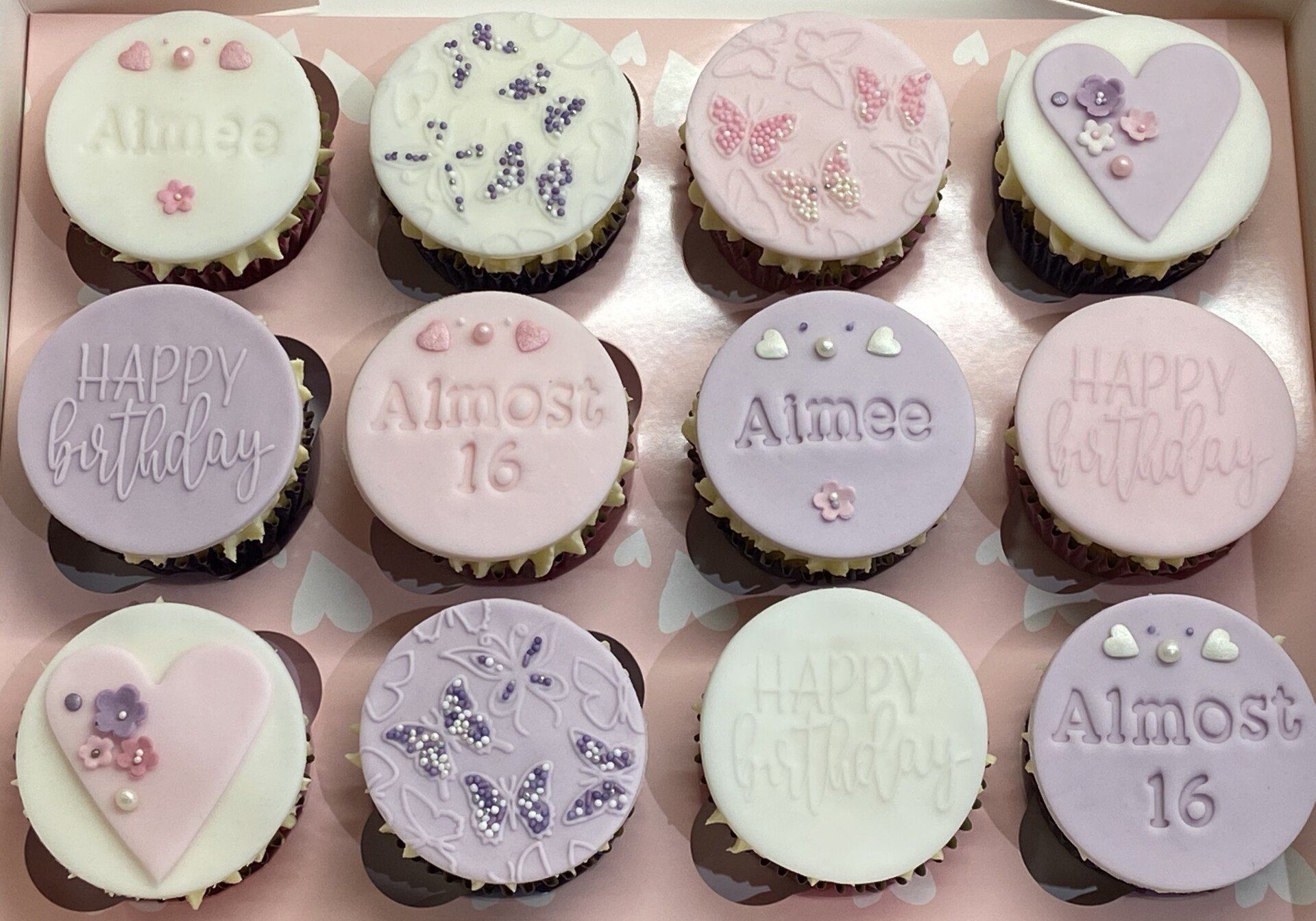 A box of cupcakes for a girl 's 16th birthday